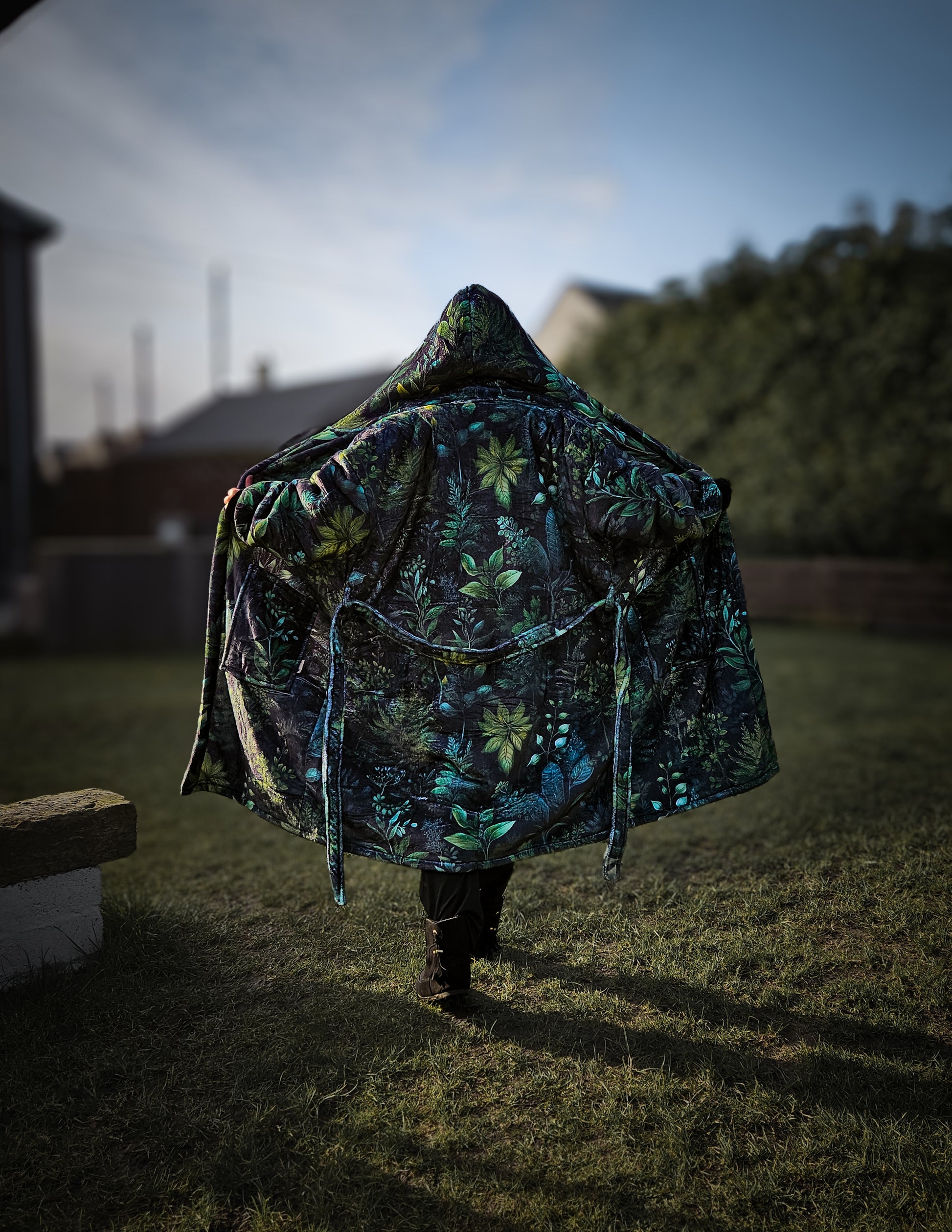 A woman wearing a Luxury Fern Fables Robe.